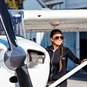 30 Minute Flying Lessons Nationwide - Woman Standing with Plane